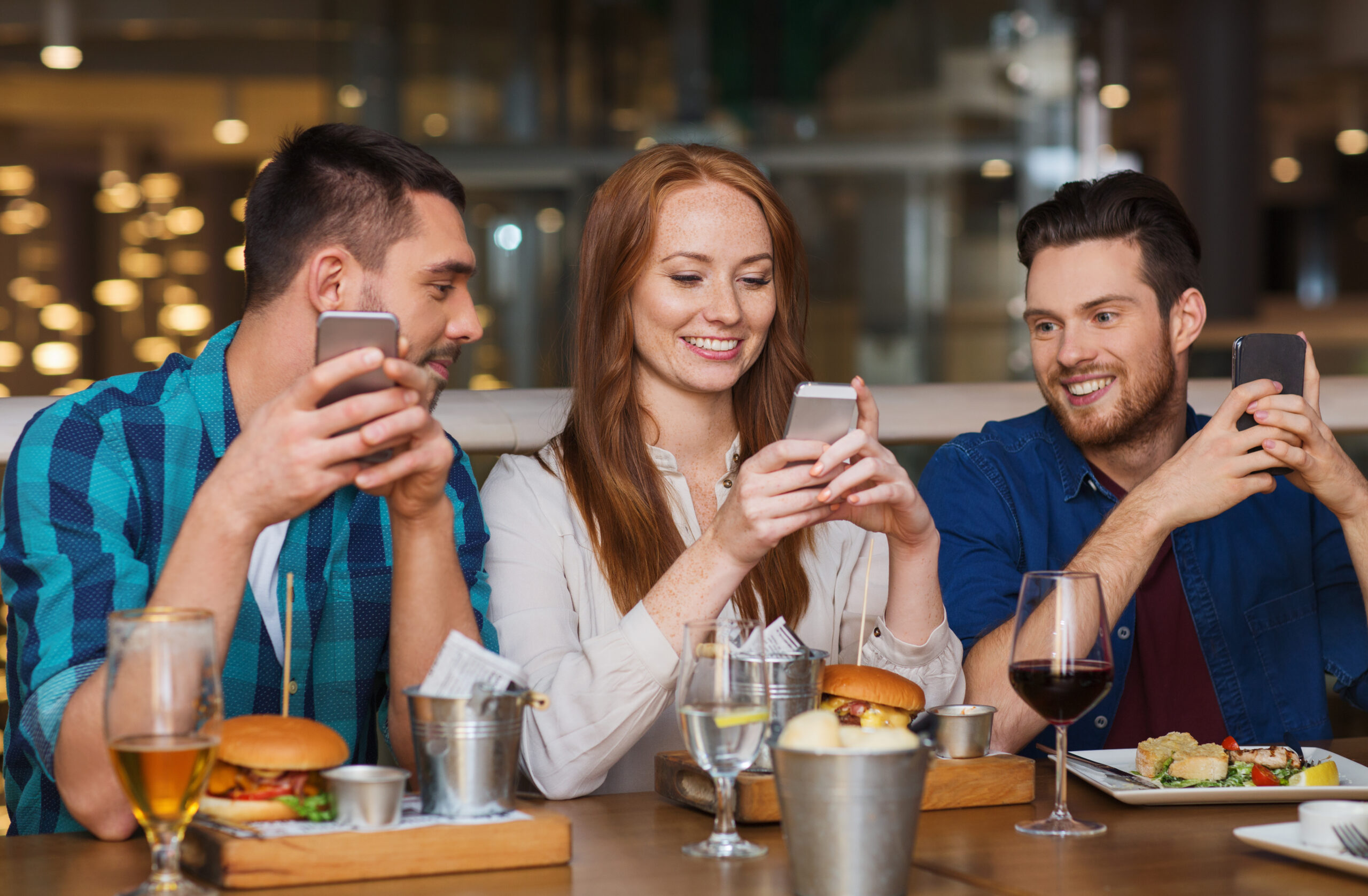 happy friends with smartphones at restaurant Google Review 5 Stars